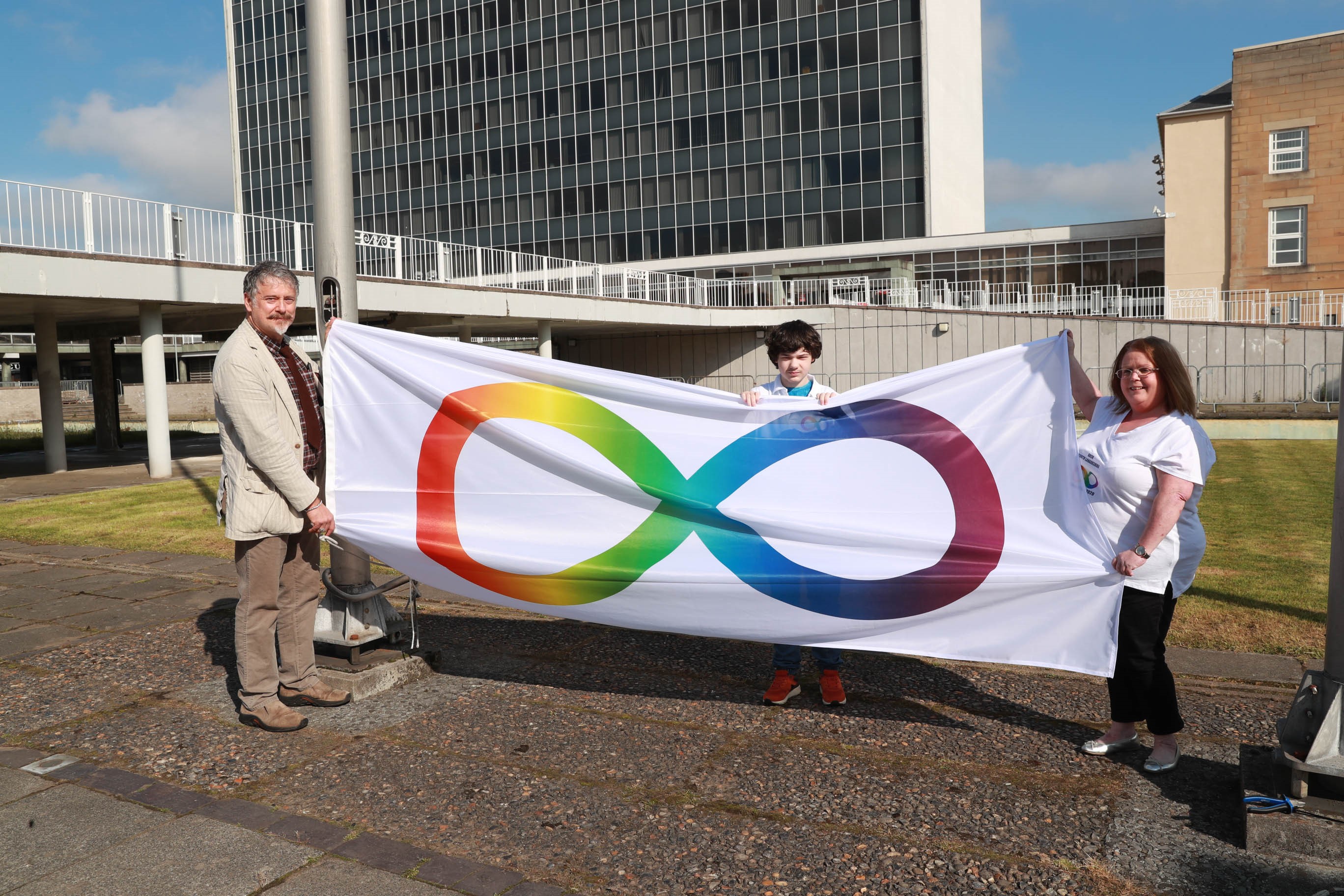 Grassroots support in Autism community celebrated as flag hoisted high